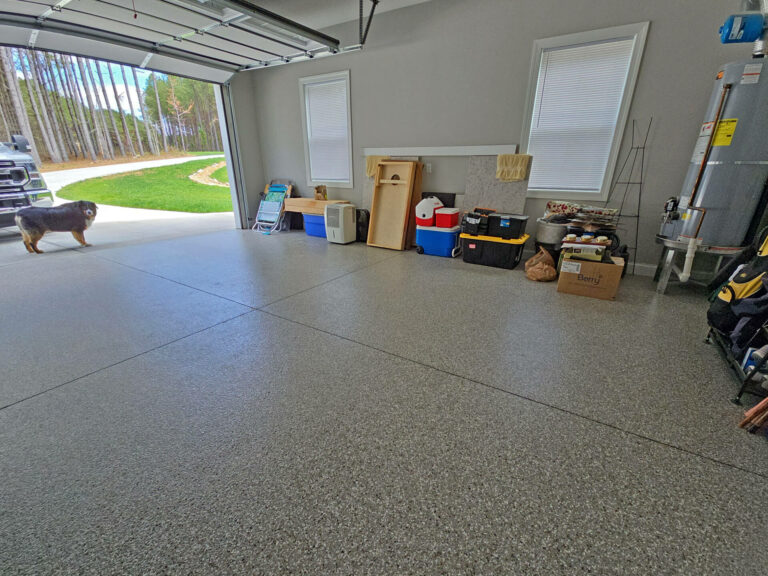 Residential epoxy garage floor in Tennessee with gray flake finish and durable coating