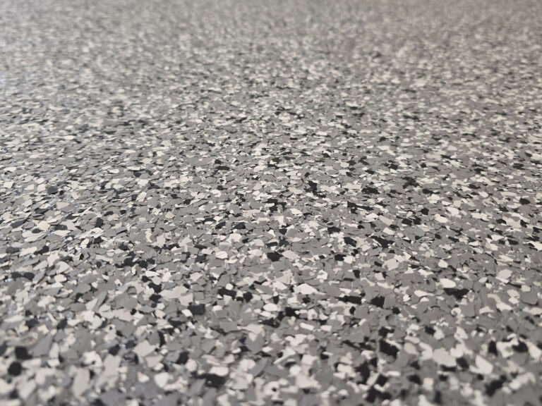 Gray epoxy flake flooring texture showing detailed surface finish