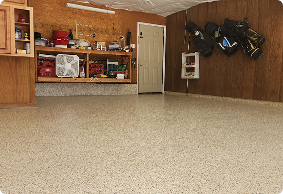Epoxy flake flooring in a residential garage providing durable, easy-to-clean surface with beige tone