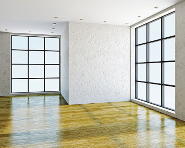 Bright modern room with large windows and glossy epoxy-coated wood-look floor finish